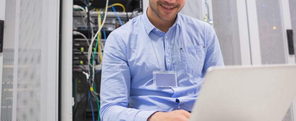 happy-man-using-laptop-to-check-servers