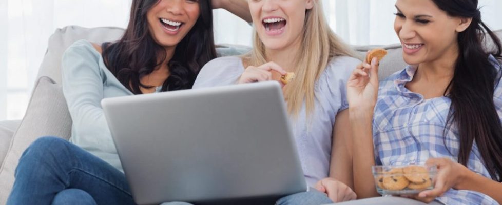 Friends laughing with cookies, while eating cookies!