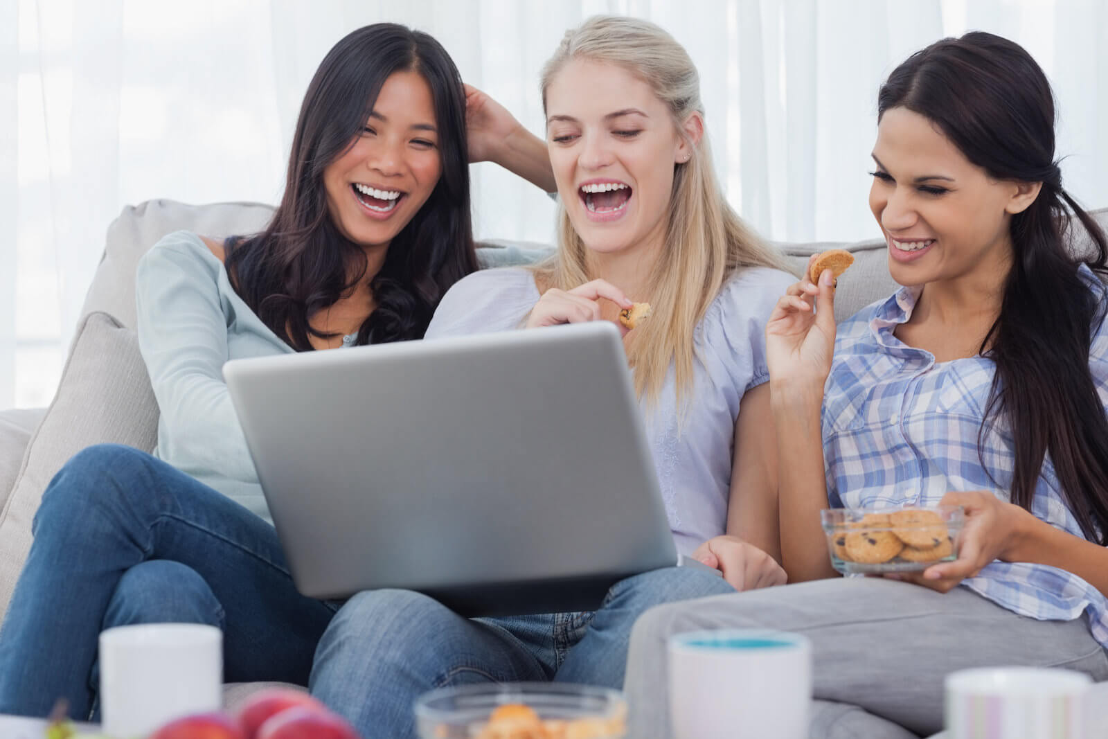 Friends laughing with cookies, while eating cookies!